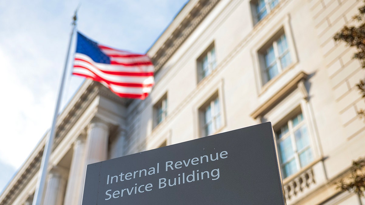 IRS building sign with American flag flying outside in Washington, D.C.