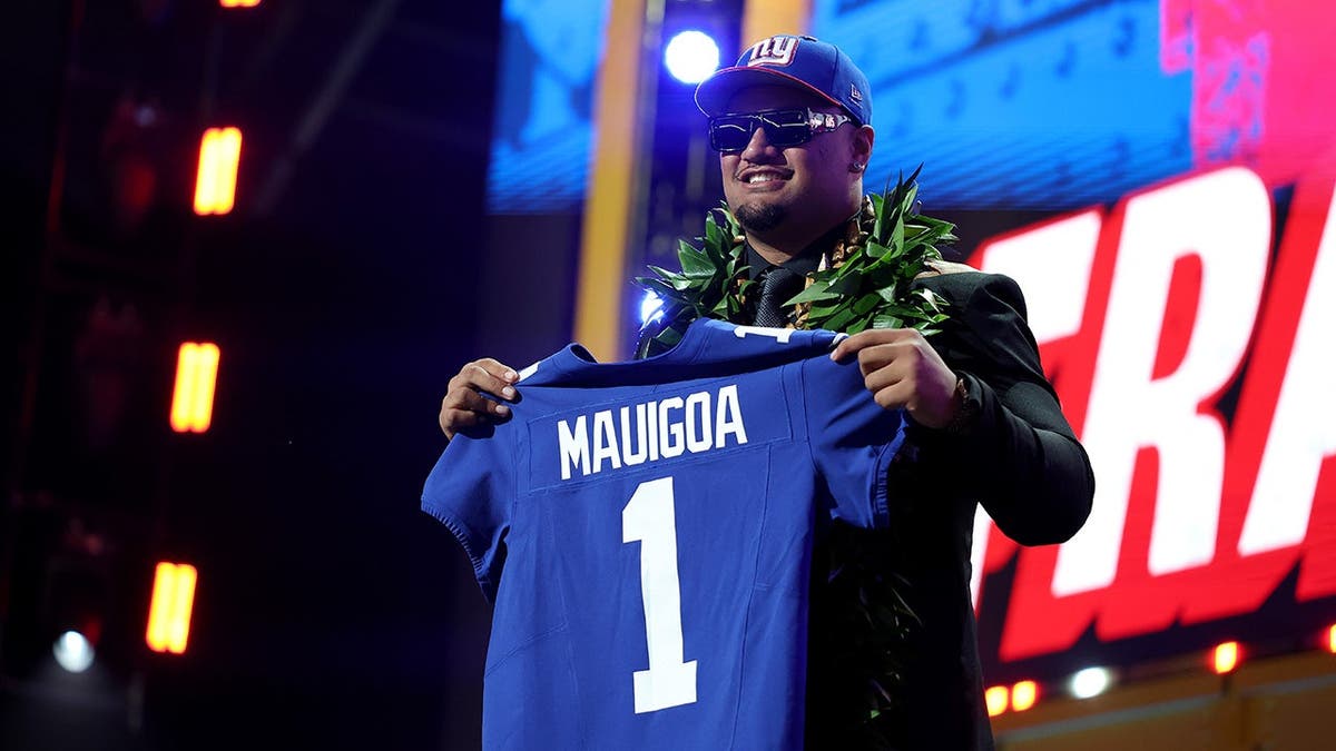 Francis Mauigoa celebrating after being selected by the New York Giants at the NFL Draft.
