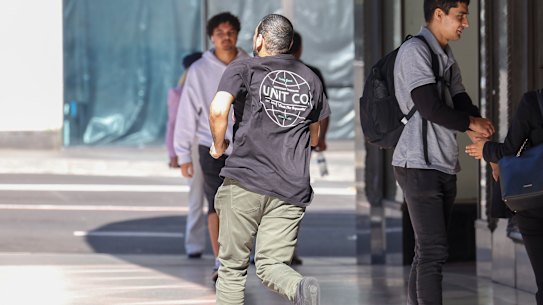 Sacked transport official Ibrahim Helmy runs from the Downing Centre on Thursday after his sentencing.
