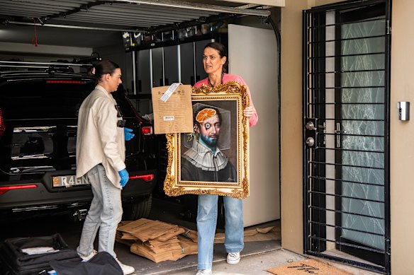 Police remove potential evidence from the Erskineville home of Annalouise Spence during a search warrant on Wednesday.
