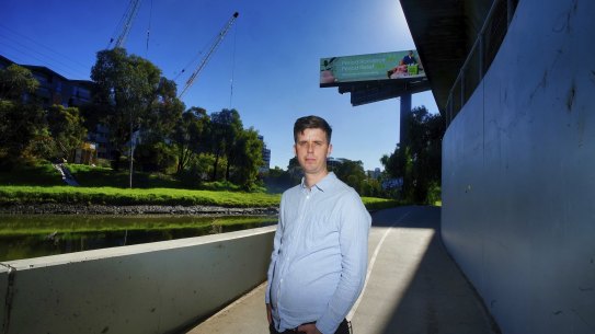Adrian Jackson, who is moving into a Macaulay apartment block, stands by the Moonee Ponds Creek.