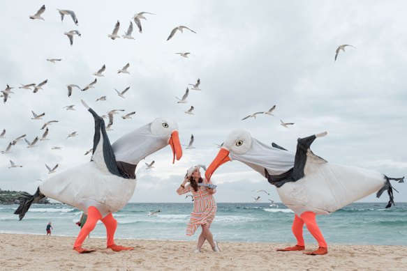 Then-Sydney Festival director Olivia Ansell at Bondi Beach in 2024 with Snuff Puppets’ giant seagulls.