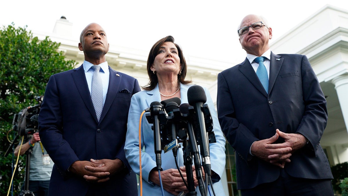 Wes Moore, Kathy Hochul, and Tim Walz speaking to media outside the White House