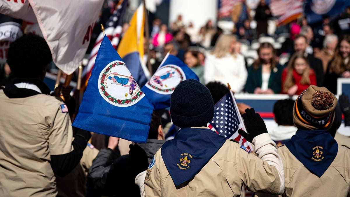 Boy Scouts marching in a parade for Gov. Abigail Spanberger