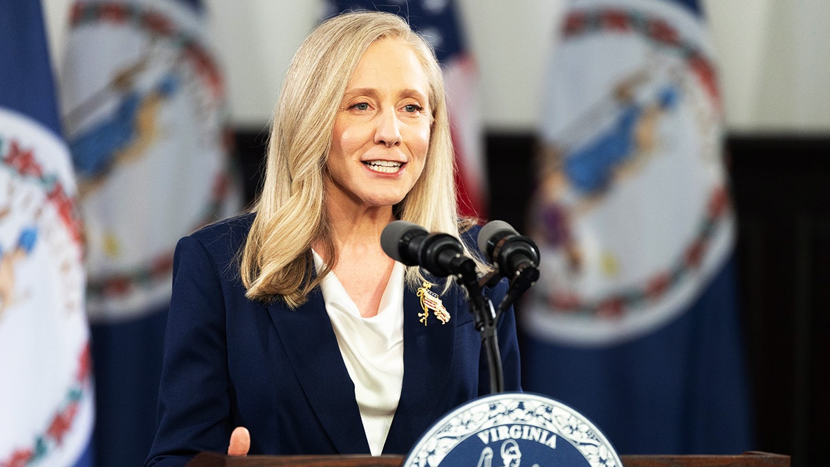 Abigail Spanberger speaking at a podium during an event.