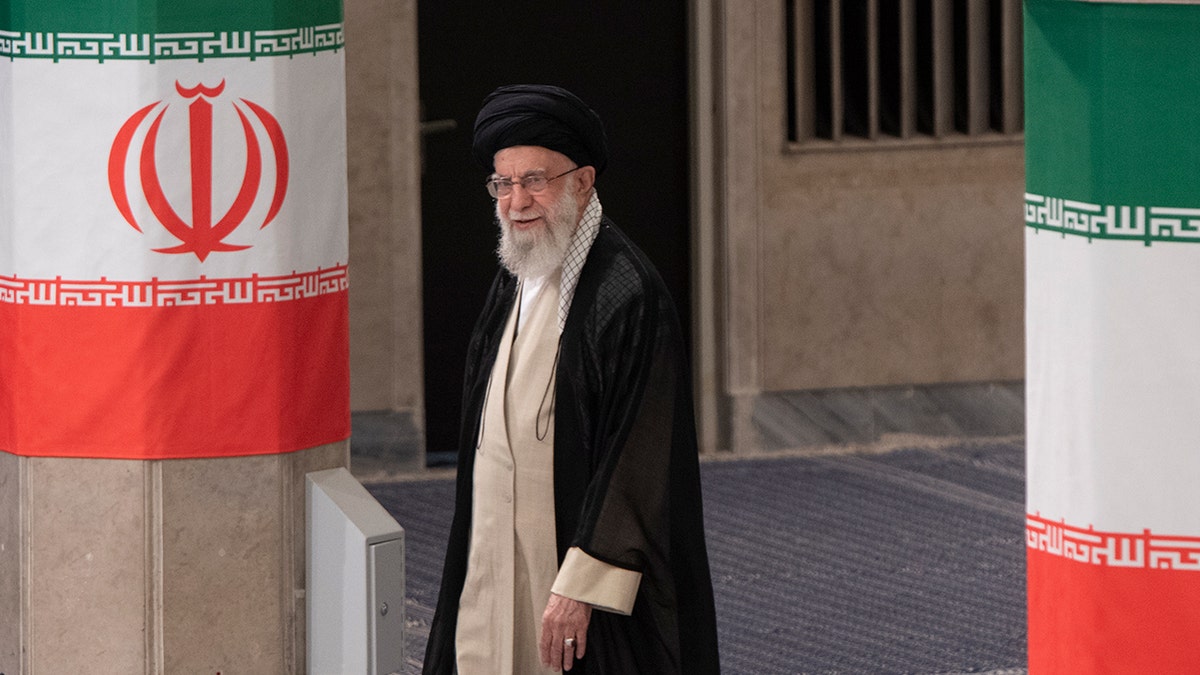 Ayatollah Ali Khamenei arriving to cast his vote during the 2024 presidential election