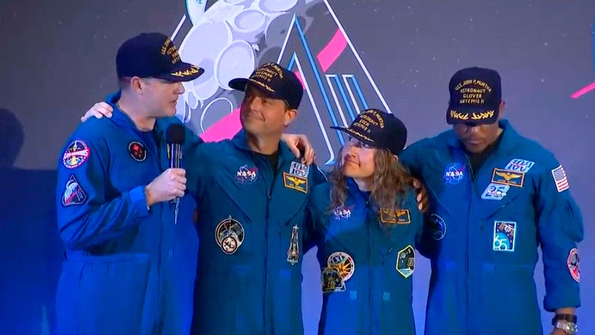 Artemis II crew on stage at welcome home ceremony