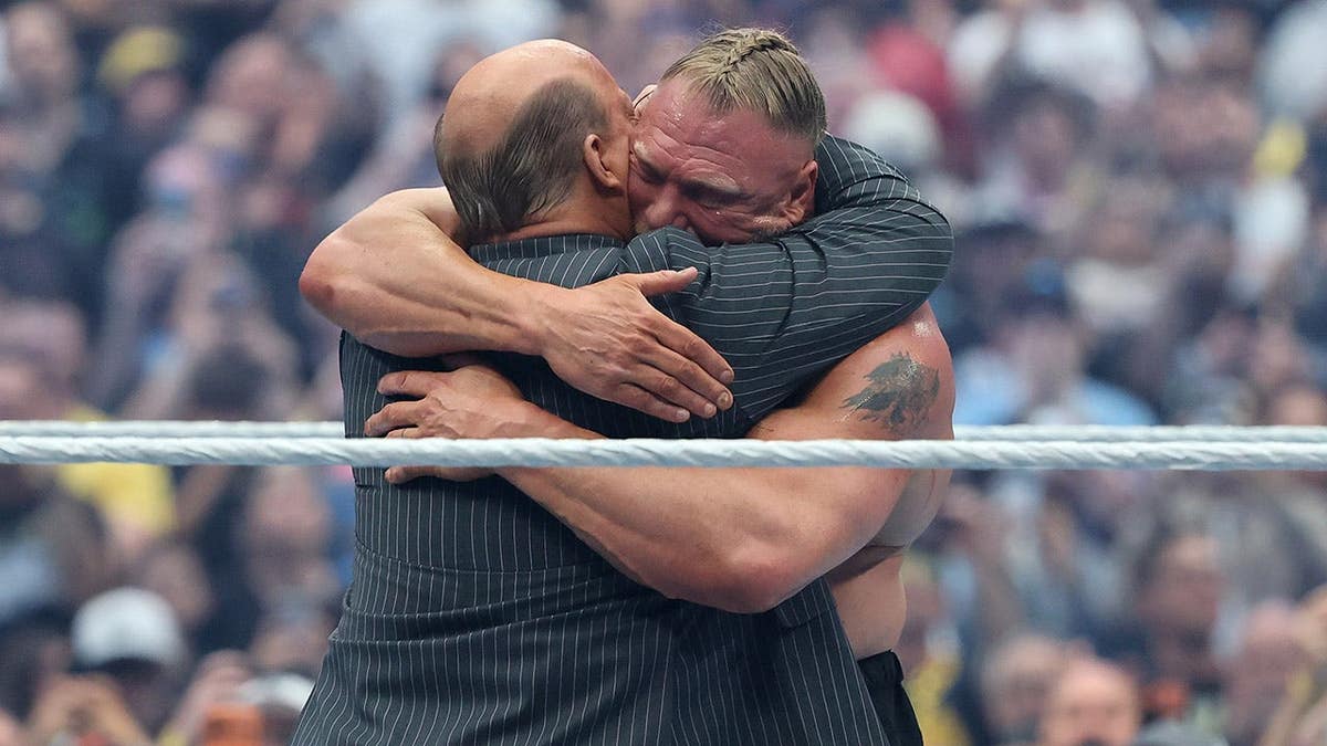 Paul Heyman hugging Brock Lesnar at Allegiant Stadium in Las Vegas