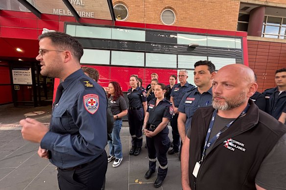 Ambulance Victoria chief executive Jordan Emery addressed the media with union secretary Danny Hill (right) and other paramedics on Thursday.