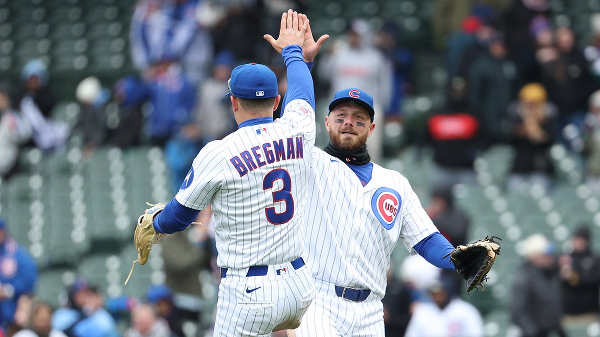 Alex Bregman and Michael Busch celebrate