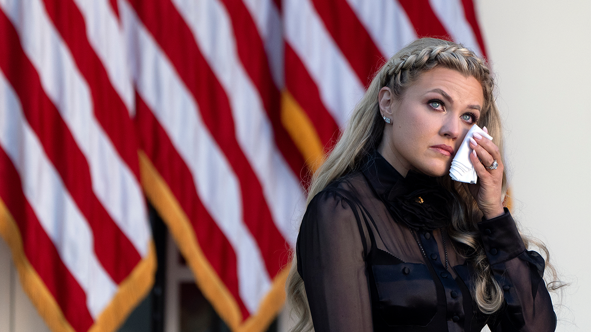 Erika Kirk appearing emotional in the White House Rose Garden