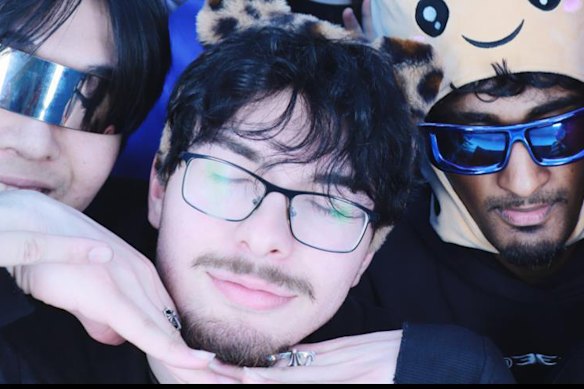 Aksoy (centre) with friends.