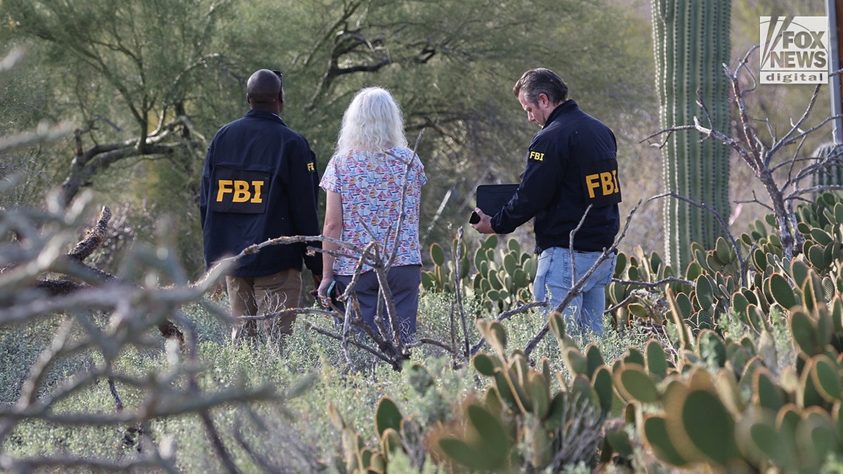 FBI agents searching behind Nancy Guthrie's home in Tucson