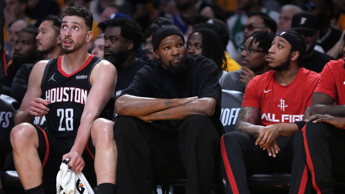 Houston Rockets C Alperen Sengun and wing Kevin Durant sit on the bench against the Los Angeles Lakers during Game 1 of the first round of the 2026 NBA Playoffs at Crypto.com Arena.