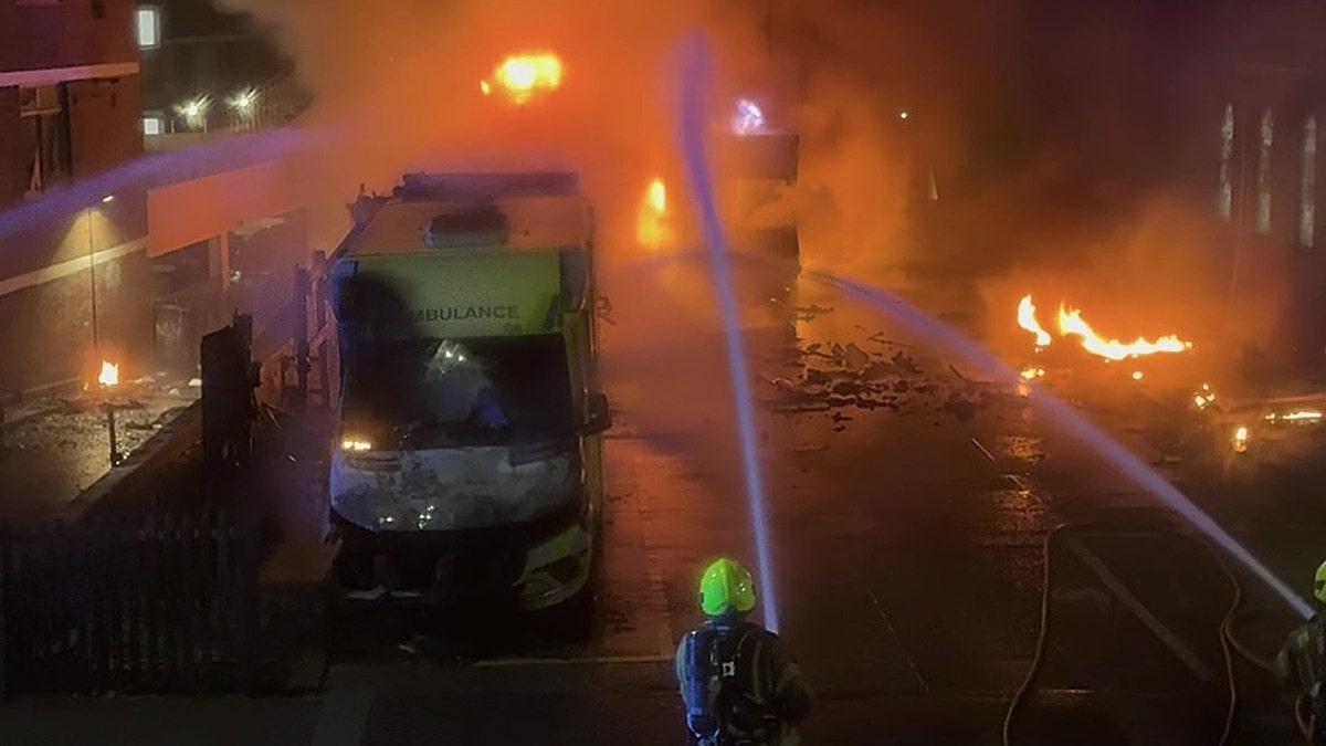 Firefighters extinguishing fire at Highfield Road in Golders Green London