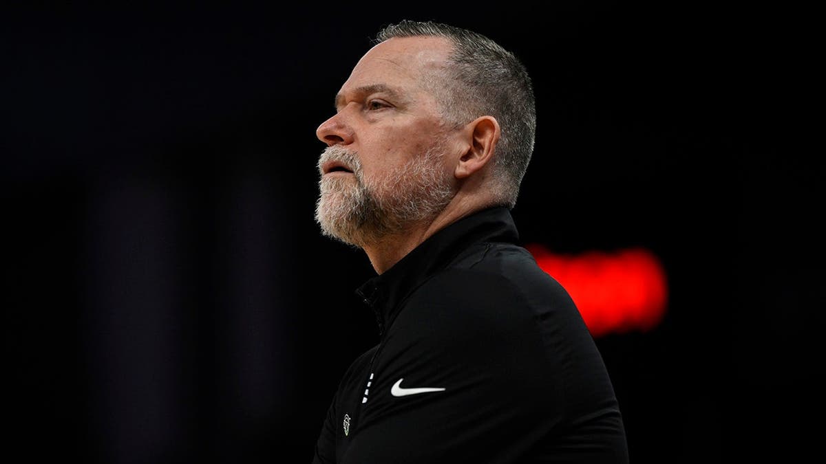 Head coach Michael Malone of the Denver Nuggets looking on during a basketball game at Chase Center