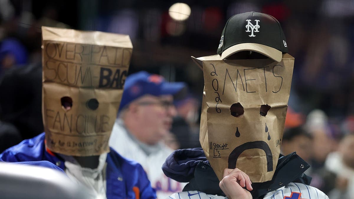 A New York Mets fan expressing frustration at Citi Field during a game.