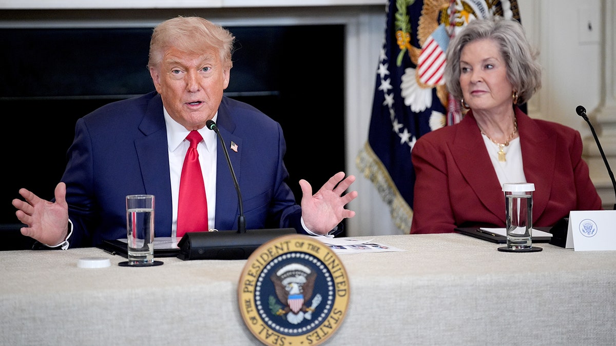 President Donald Trump and White House Chief of Staff Susie Wiles seated during Invest America roundtable