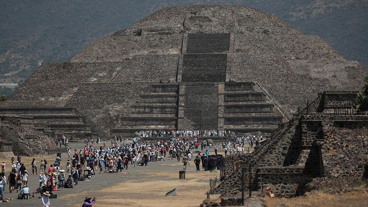 People visiting the Pyramid of the Sun at Teotihuacan near Mexico City.