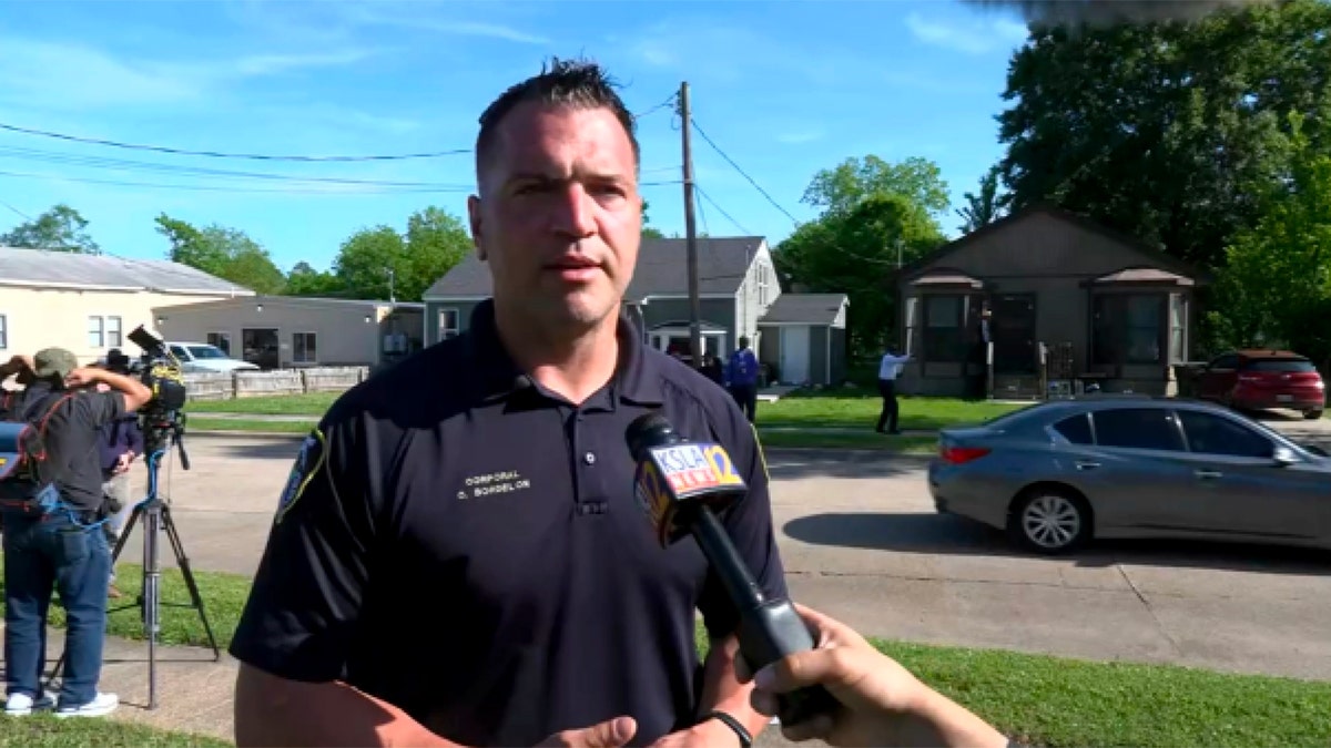 Shreveport Police spokesperson Chris Bordelon speaks to reporters at shooting scene