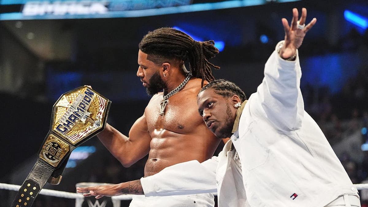 Trick Williams and Lil Yachty celebrating during SmackDown at Enterprise Center