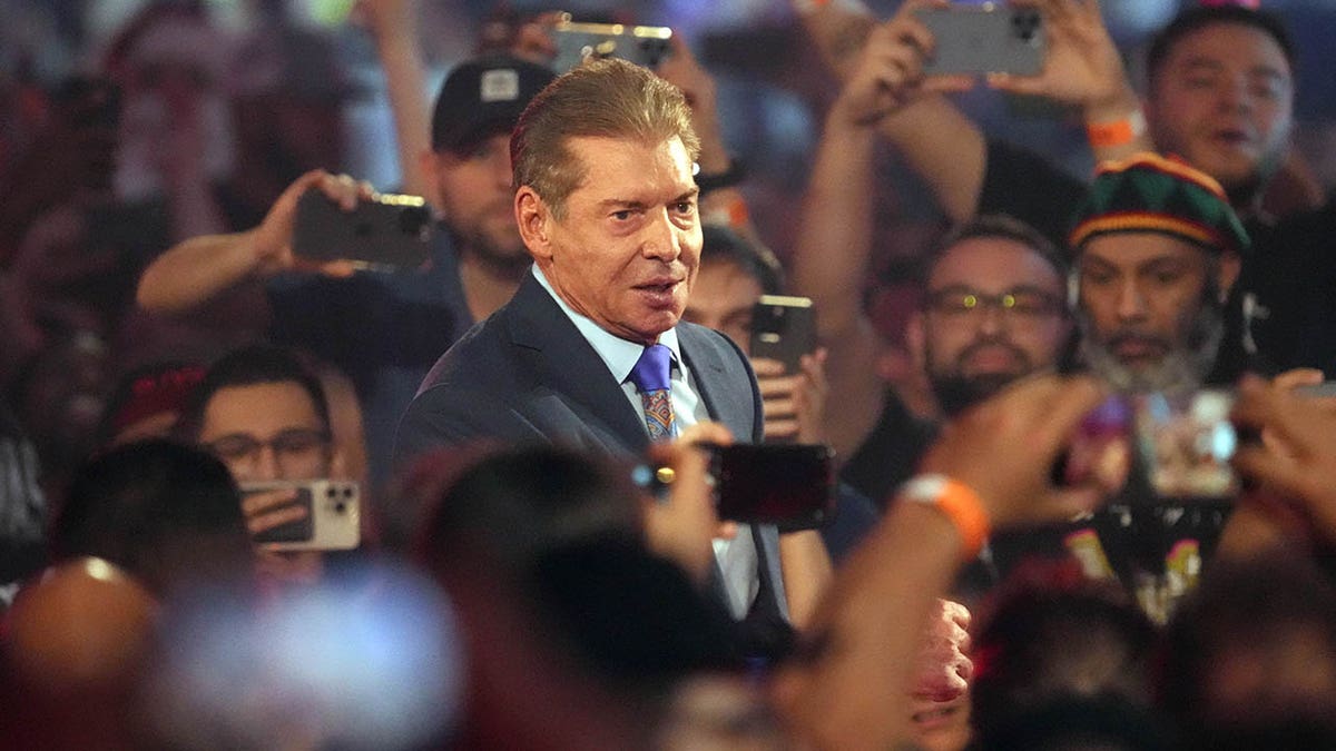 WWE owner Vince McMahon entering arena at AT&T Stadium in Arlington Texas