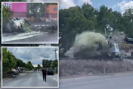 Horror as train collides with truck carrying septic tank, seriously injuring driver: video