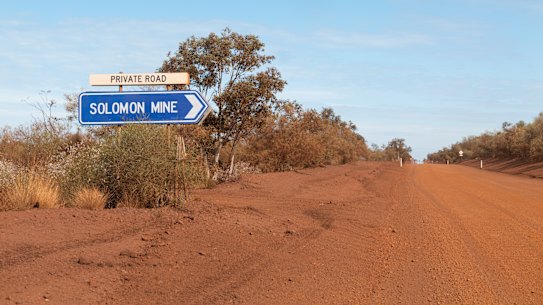 On the outskirts of Karijini National Park, the sign for Solomon Mine in the Pilbara Region in Western Australia.