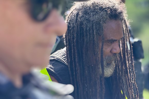 Uncle Derek Oram being led away after his arrest at Victoria Park.