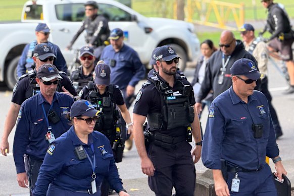 Police and council officers arrive to disperse the anti-stadium protests at Victoria Park.
