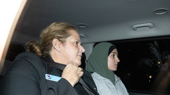 Janai Safar is taken to Mascot police station after arriving at Sydney airport from Doha. 