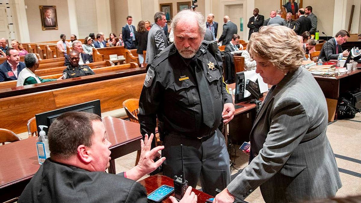 Clerk of Court Becky Hill speaks with law enforcement during Alex Murdaugh's 2023 trial