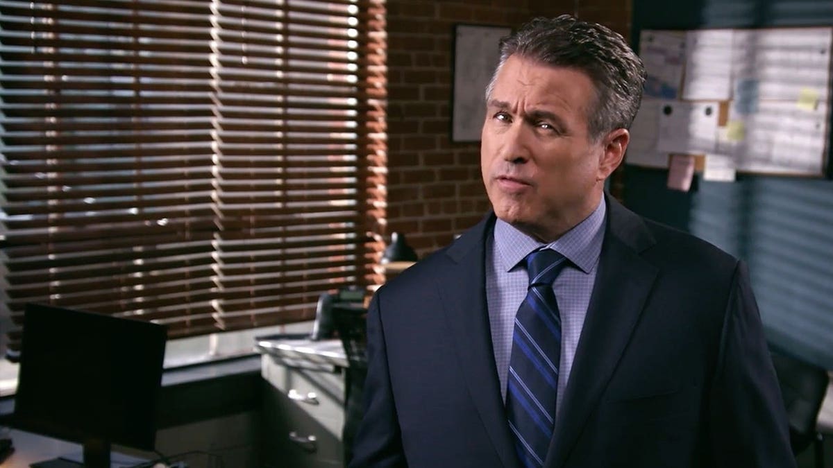 Chris McMullin in a dark blue suit.