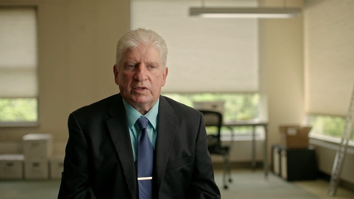 Detective John Taggart standing in a room
