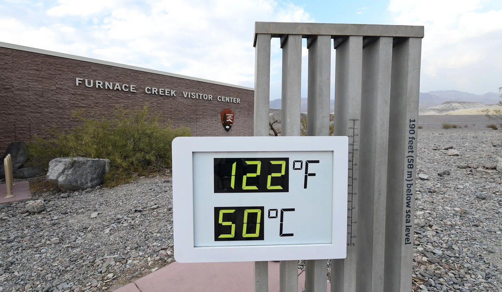 The temperature gauge at the Furnace Creek Visitors Center in Death Valley in California displays 125 degrees after 7 p.m. on July 11, 2021. (Photo by FREDERIC J. BROWN/AFP via Getty Images)