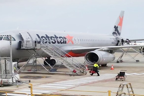 An image of a teenager who allegedly attempted to hijack Avalon plane boarding the flight in high-vis. 