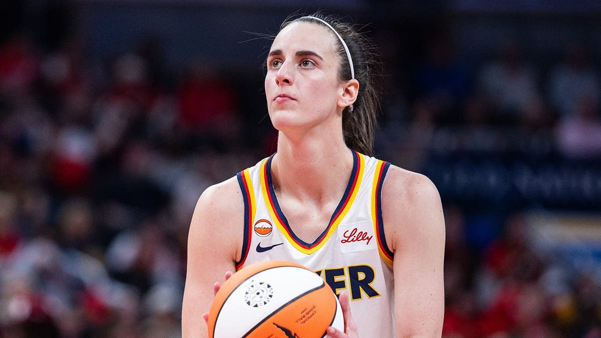 Indiana Fever guard Caitlin Clark shooting a basketball during a game at Gainbridge Fieldhouse