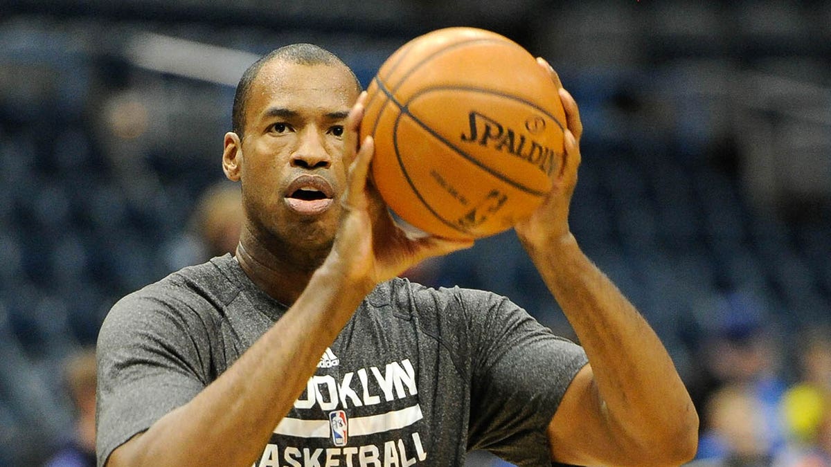 Brooklyn Nets center Jason Collins warming up on basketball court