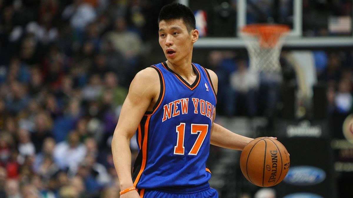 New York Knicks guard Jeremy Lin dribbling basketball against Minnesota Timberwolves at Target Center