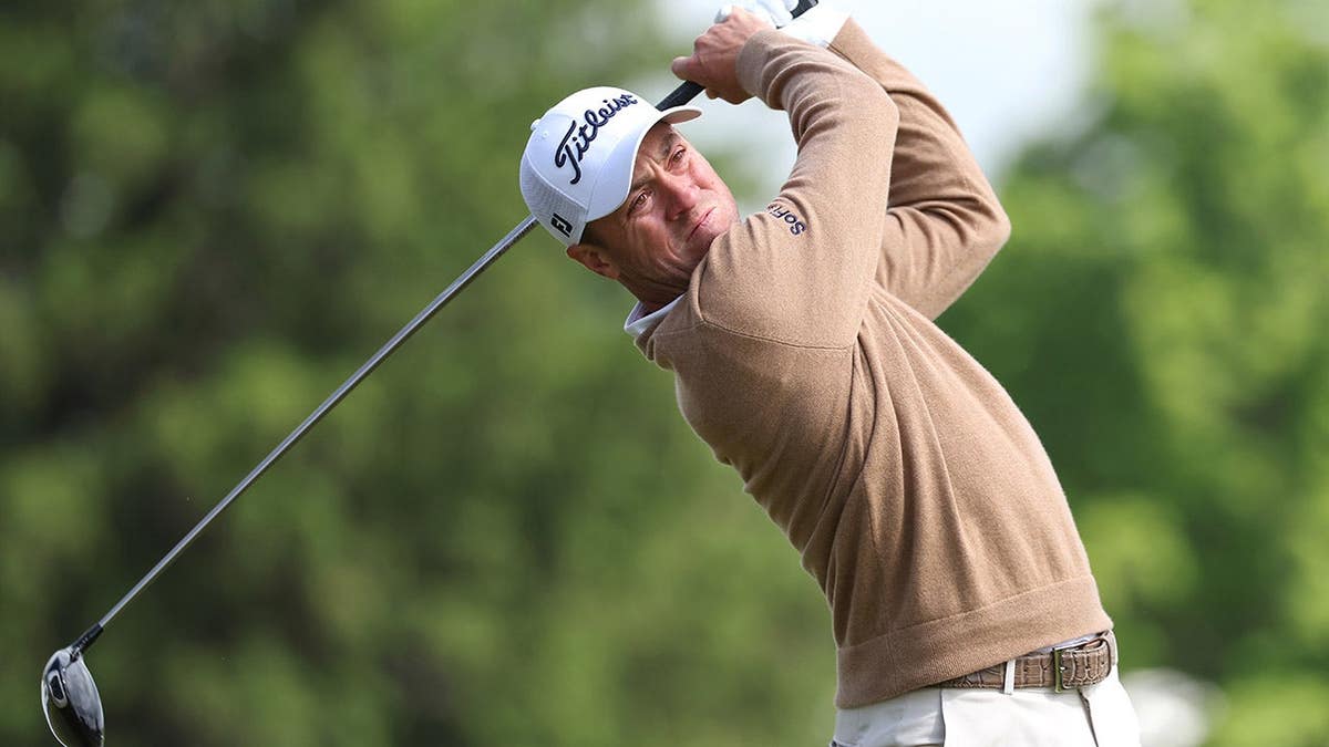 Justin Thomas playing a golf shot on the 15th tee.