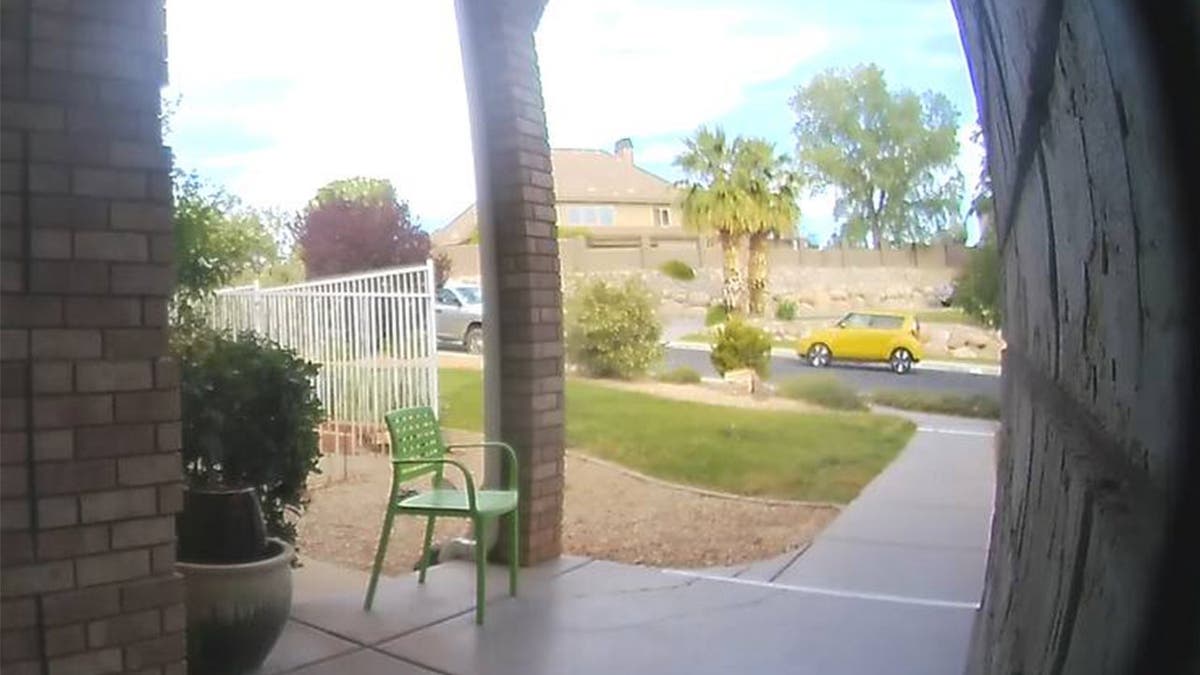 A yellow Kia Soul is seen on doorbell video.