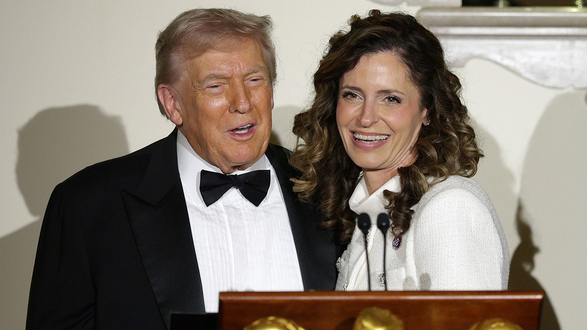 President Donald Trump standing with Rep. Julia Letlow in the White House Grand Foyer