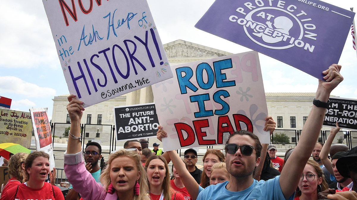 Pro-life supporters holding signs outside the US Supreme Court in Washington, D.C.