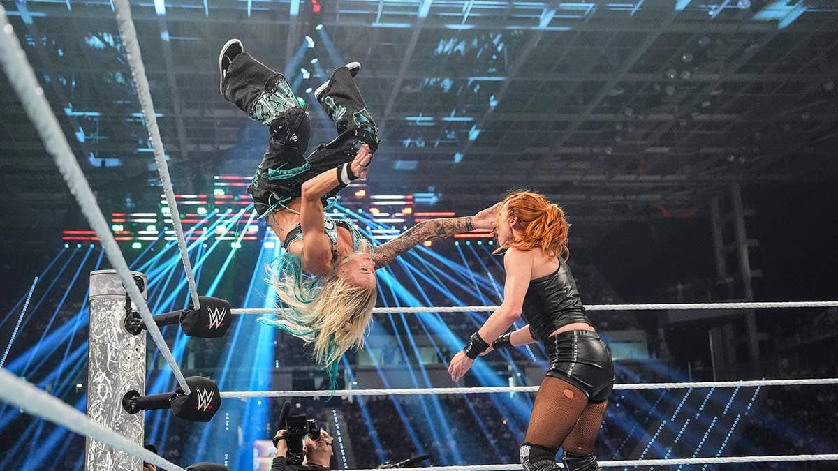 Sol Ruca performing a Sol Snatcher move on Becky Lynch in a wrestling ring