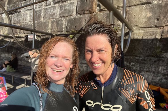 Helen Pitt with fellow ocean swimmer Ali Gripper after they swam to the south head of Coogee in June last year. They noted whales in the water, though no sharks.