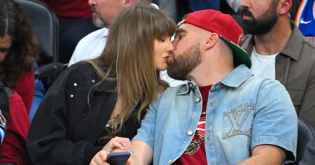 Travis Kelce Honors Taylor Swift With ‘Pretty Man’ Movie Poster at ‘New Heights’ Live Show in L.A.
