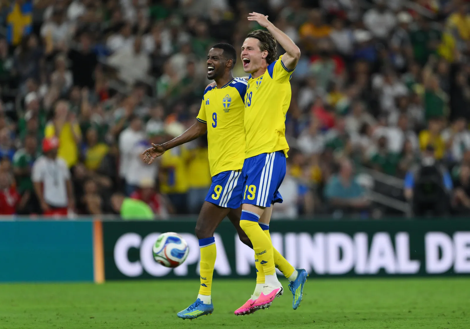 MONTERREY, MEXICO - JUNE 14: Mattias Svanberg #19 of Sweden celebrates scoring his team's fourth goal with teammate Alexander Isak #9 during the FIFA World Cup 2026 Group F match between Sweden and Tunisia at Monterrey Stadium on June 14, 2026 in Monterrey, Mexico. (Photo by David Ramos/Getty Images)