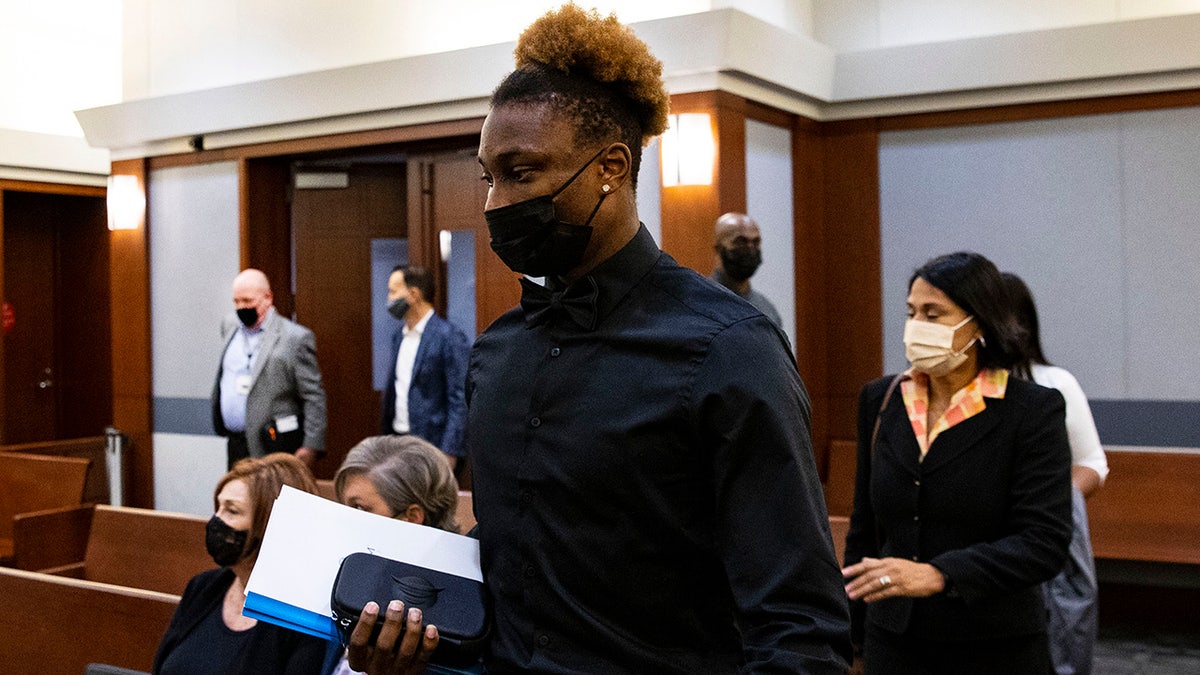 Former Las Vegas Raiders player Henry Ruggs III standing in court at the Regional Justice Center in Las Vegas