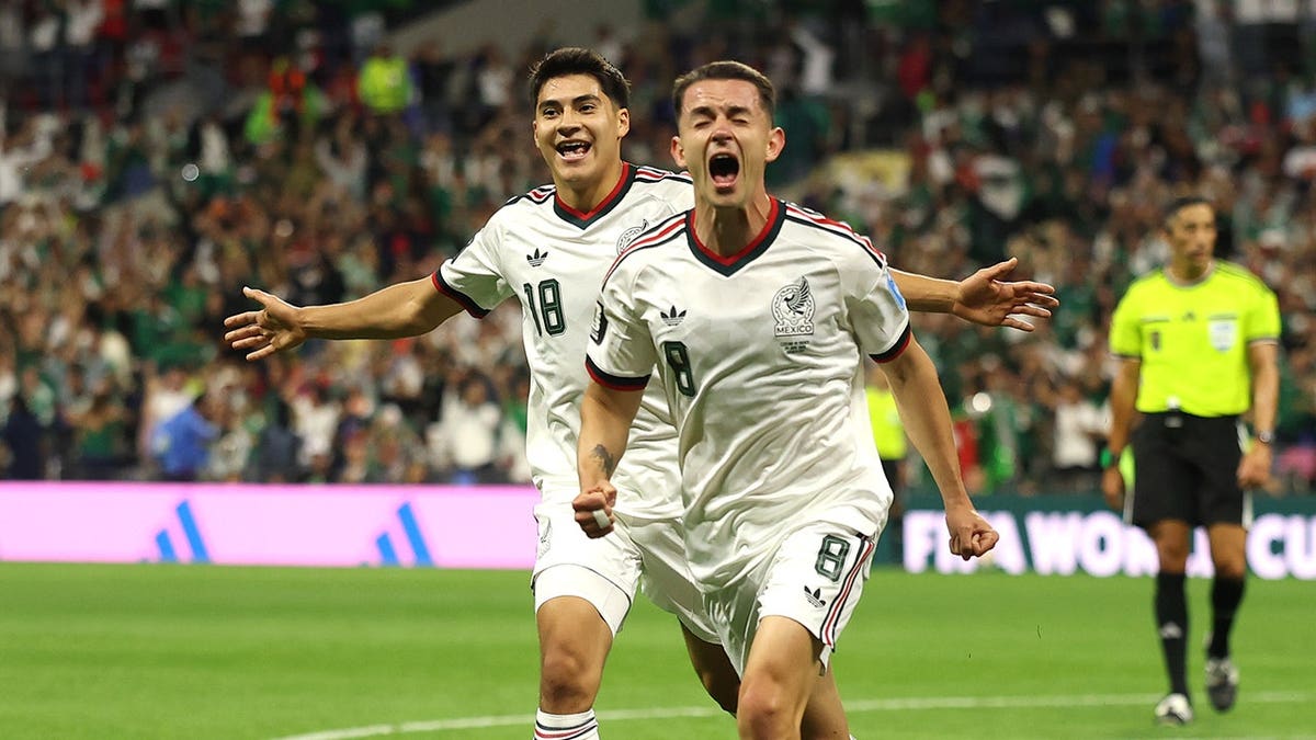 Alvaro Fidalgo celebrating after scoring a goal during a soccer match at Mexico City Stadium.