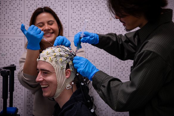 Neuroscience researcher Dr Dominic Tran and research assistant Styliani Katsoulis during set up. I am smiling through fear.